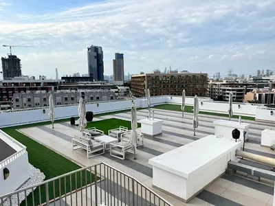 a rooftop with tables and chairs on a building at Dubai heaven in Dubai