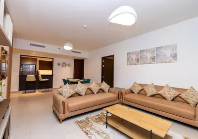 a living room with two couches and a coffee table at Luxury stay at Downtown Dubai-Walk to Burj Khalifa in Dubai