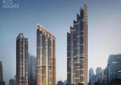 three tall skyscrapers in a large city at Luxury stay at Downtown Dubai-Walk to Burj Khalifa in Dubai