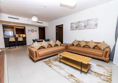 a living room with two couches and a coffee table at Luxury stay at Downtown Dubai-Walk to Burj Khalifa in Dubai