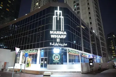 a large building with a sign on the side of it at Stylish Marina Stay Near Bla Bla club & JBR Walk in Dubai