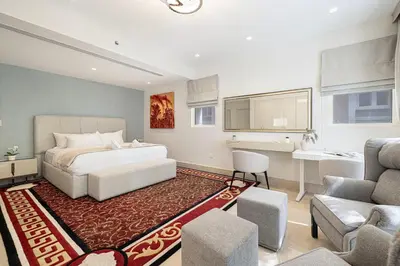 a bedroom with a bed and a living room at Villa with Private Pool in Palm Jumeirah in Dubai