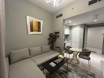 a living room with a couch and a table at Zada Tower, Business Bay in Dubai