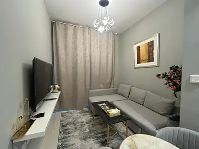 a living room with a couch and a table at Zada Tower, Business Bay in Dubai