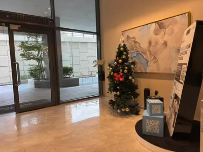 a christmas tree in a room with a building at Zada Tower, Business Bay in Dubai