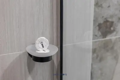 a bathroom with a soap dispenser on a wall at Luxury 1BR with 2 Balconies Dubai Science Park in Dubai