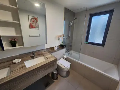 a bathroom with a sink and a toilet and a mirror at 5 bedroom Villa in Maple 2 Dubai Hills Estate in Dubai