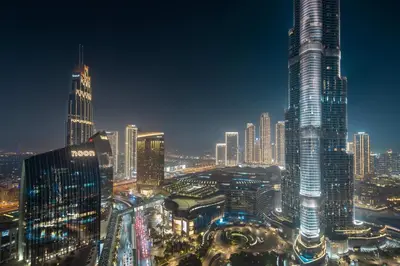 a night view of a large city with tall buildings at Frank Porter - Burj Vista Tower 1 in Dubai