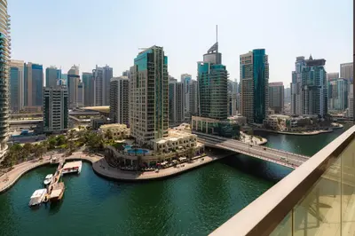 an aerial view of a city with a bridge at Scenic - Contemporary - Marina Getaway in Dubai