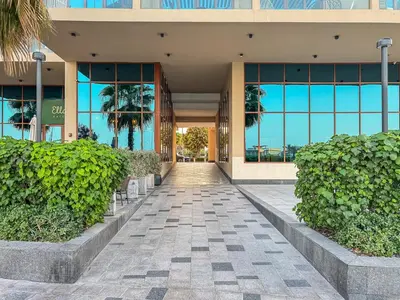 a building with a walkway in front of it at Elegant Studio on Palm Jumeirah With Stunning Views in Dubai
