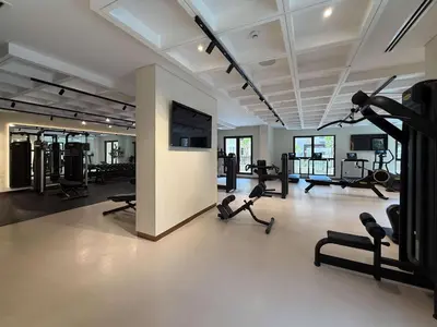 a gym with treadmills and elliptical machines at Frank Porter - Jadeel 3 in Dubai