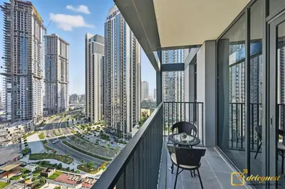 a balcony with a view of a city at Premium 1BR with Panoramic Views Creek Harbour Steps from Creek Harbour Walk in Dubai