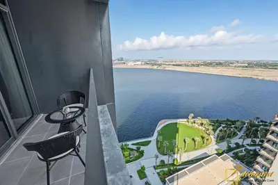 a view of the water from the balcony of a building at Premium 1BR with Panoramic Views Creek Harbour Steps from Creek Harbour Walk in Dubai