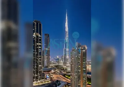 a view of a city skyline with a tall skyscraper at Aspin 3BR Iconic Burj Khalifa Live Fountain View in Dubai
