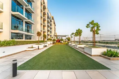 a lawn in the middle of a building at Livin' Holidays - Studio - Stylish Stay in Azizi in Dubai