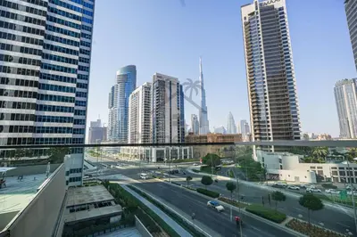 a view of a city with tall buildings and a street at Marquise Square 410 in Dubai