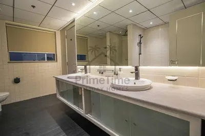 a bathroom with a sink and a large mirror at Sparkle 205 in Dubai