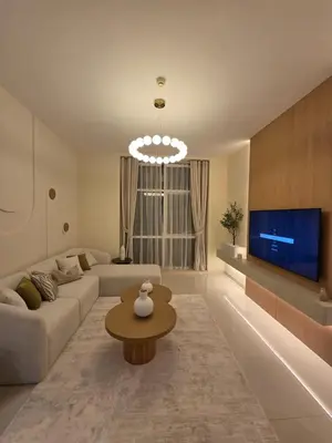 a living room with a couch and a table at Duja Tower 4404 in Dubai