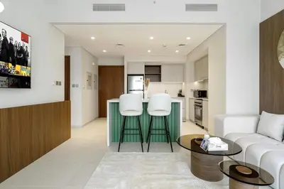 a living room with a couch and a table at 833keys - 1BR - Lagoon Access - Vida Creek Beach - Creek Harbour - Dubai in Dubai