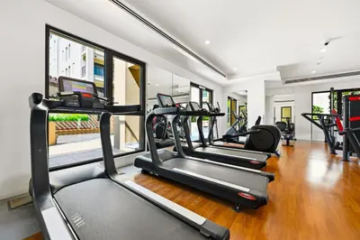 a gym with several treadmills in a room at Luxury 1BD Stay in Lamtara 2, Near Jumeirah Burj in Dubai