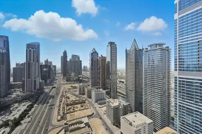 an aerial view of a city with tall buildings at CH Burj Khalifa View Pool 1BR Paramount Escape in Dubai