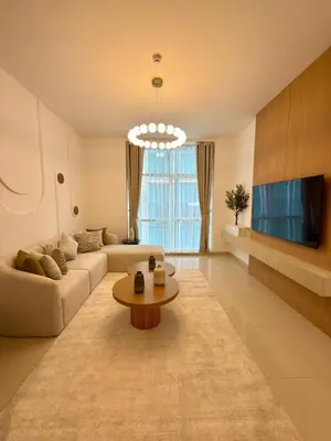 a living room with a couch and a table at Duja Tower 4405 in Dubai