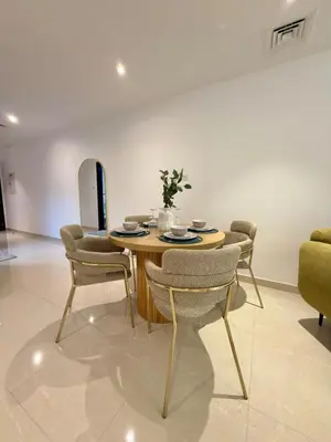 a dining room with a table and chairs at Duja Tower 4405 in Dubai