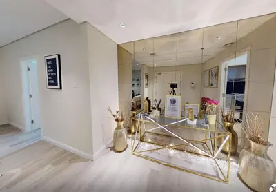 a room with a mirror and vases on the floor at SkyRise Apartment with Stunning Sea View on 89 Floor in Dubai