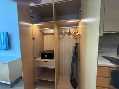 a kitchen with a closet with a sink and a microwave at Luxery Hotel Apartment l Novotel Residence l JVT in Dubai