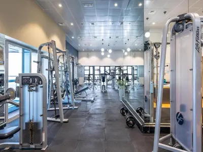 a gym with a lot of treadmills and machines at Premium 1BR on High Floor with Stunning Sea View and Balcony in Dubai