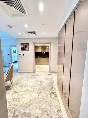 a room with a hallway with glass walls at Burj Khalifa View 2 Bed Luxury Apartment in Dubai