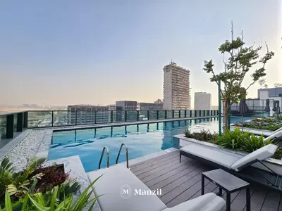 a swimming pool on the roof of a building at Luxury 1BR in Sobha Hartland w Pool & Gym Access in Dubai