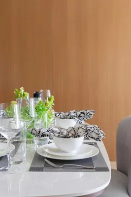 a white table with bowls and plates on it at Frank Porter - Address Opera Tower in Dubai