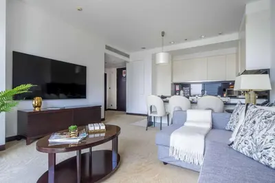 a living room with a couch and a table at Frank Porter - Marina Mall Hotel in Dubai