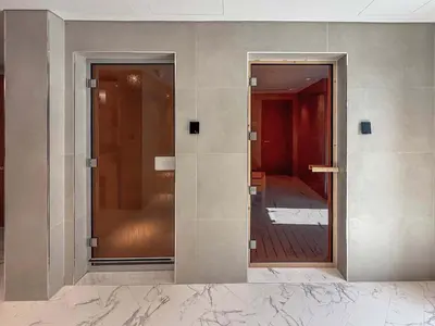 two glass doors on a wall with a hallway at Frank Porter - Azizi Riviera 51, Meydan in Dubai