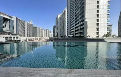 a large pool of water in a city with tall buildings at Premium Studio Majestine by DAMAC, Business Hub in Dubai