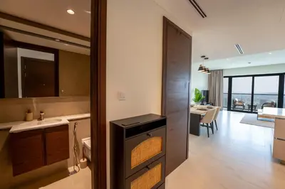 a kitchen and dining room with a view of the ocean at EasyGo - Stylish 2BR With City View in Sobha Creek in Dubai