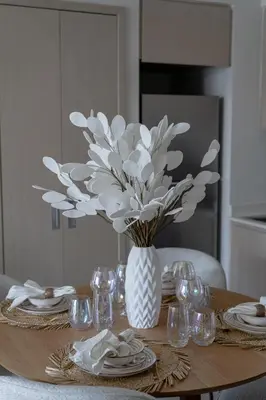 a vase of flowers sitting on top of a table at Nasma Luxury stays- Luxury-highfloor-iconic location in Dubai