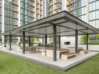 a pavilion with benches and tables in a city at FIRST CLASS 3BR Trendy Luxe Getaway in Dubai