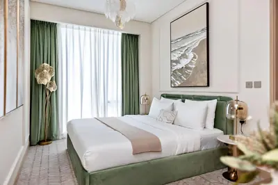 a bedroom with a large bed and a large window at Dubai Mall access Vida Stunning Design in Dubai