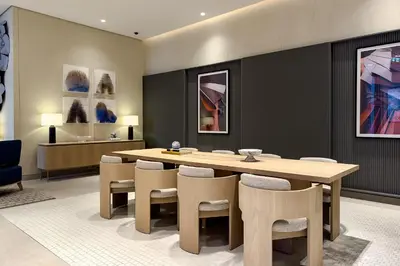 a dining room with a wooden table and chairs at Dubai Mall access Vida Stunning Design in Dubai
