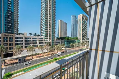 a view from a balcony of a city street with tall buildings at Urban Skyline Haven Near Burj Khalifa in Dubai