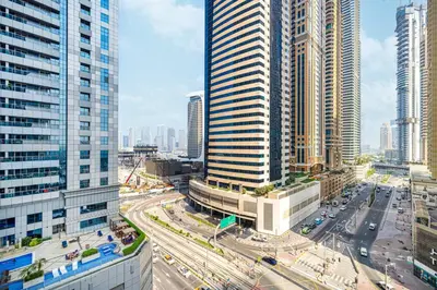 an aerial view of a city with tall buildings at StayMada - Torch Tower Elegant Marina Retreat in Dubai