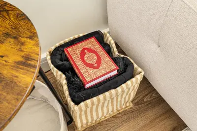 a book sitting in a basket next to a table at New 1BR with Rooftop Pool and Amazing View in Dubai