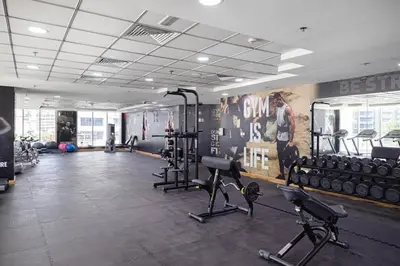a gym with several treadmills and exercise bikes at StayMada - Torch Tower Stunning Balcony City Views in Dubai