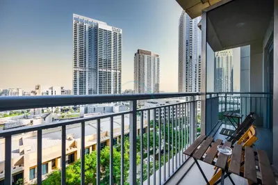 a balcony with a view of a city at Close to Ras Al Khor Wildlife Sanctuary, Just Minutes from Dubai Mall and Burj Khalifa, and Surrounded by Exceptional Amenities - Harbour Views Tower 1, Dubai Creek Harbour by Deluxe Holiday Homes in Dubai