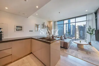 a kitchen with a sink and a large window at Bright 1BR - Unit 1806 - City Views & Fast Wi-Fi in Dubai