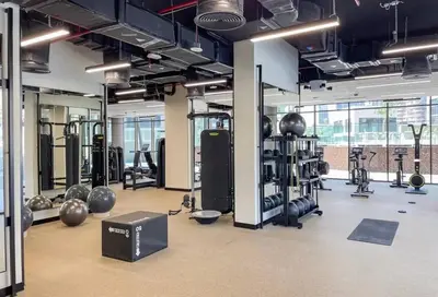 a gym with lots of equipment in a room at Studio Escape - Unit 1805 - Near Downtown! in Dubai