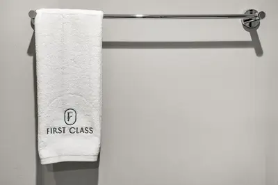 a towel hanging on a towel rack in a bathroom at FIRST CLASS 1BR Pool View & Prime Location in Dubai