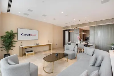 a living room with a couch and chairs and a table at Five Palm Luxury Stay 2BR with Pool & Beach Access in Dubai